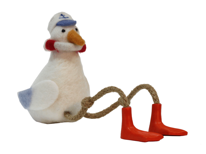 Vilten zittende meeuw met boei