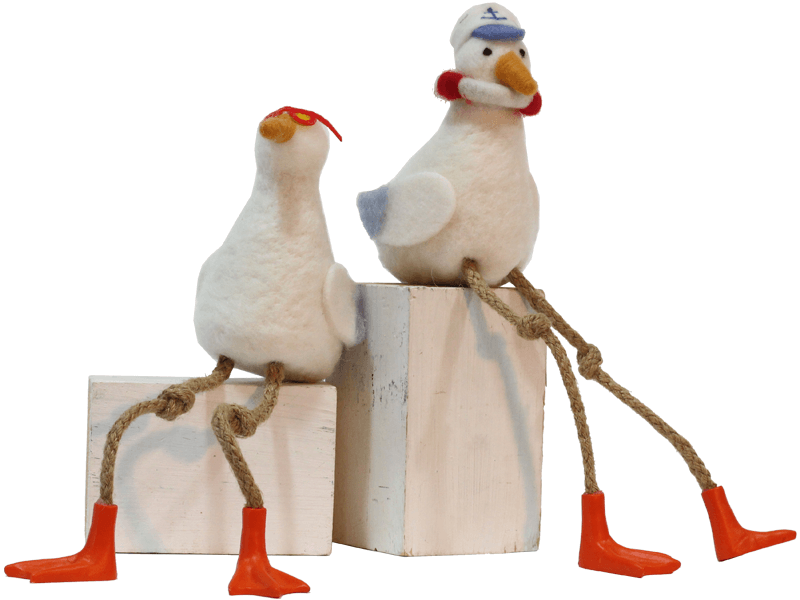 Vilten zittende meeuw met boei