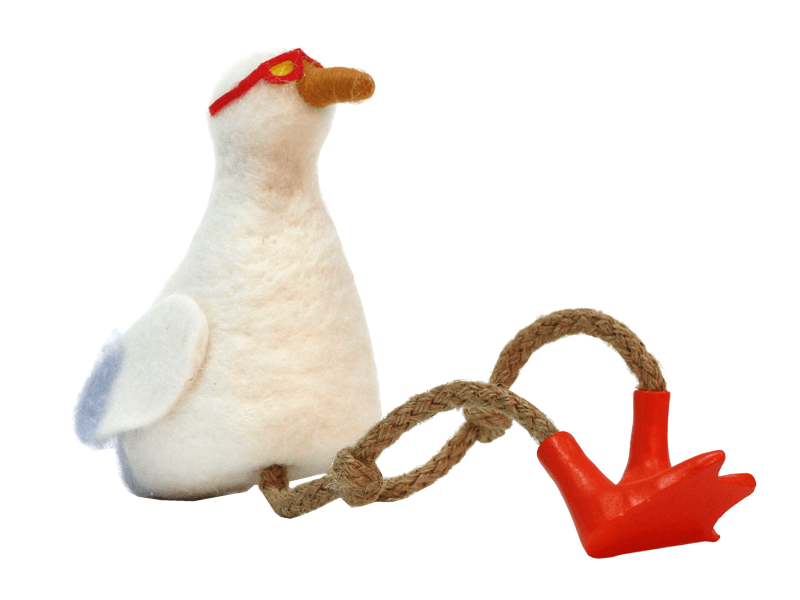 Vilten zittende meeuw met touwbenen