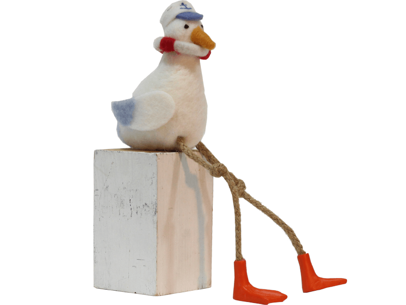 Vilten zittende meeuw met boei